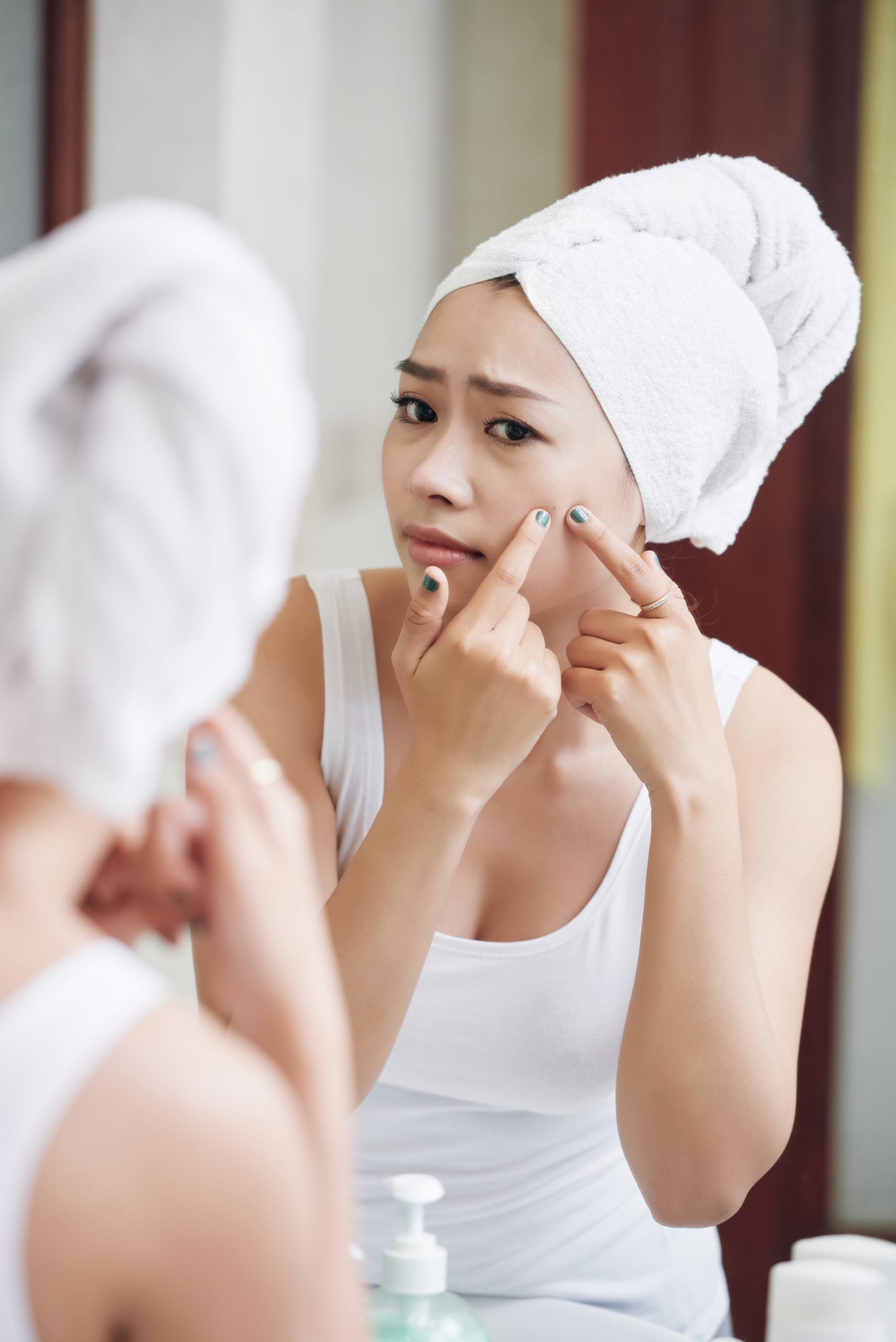 How do hormones cause acne?