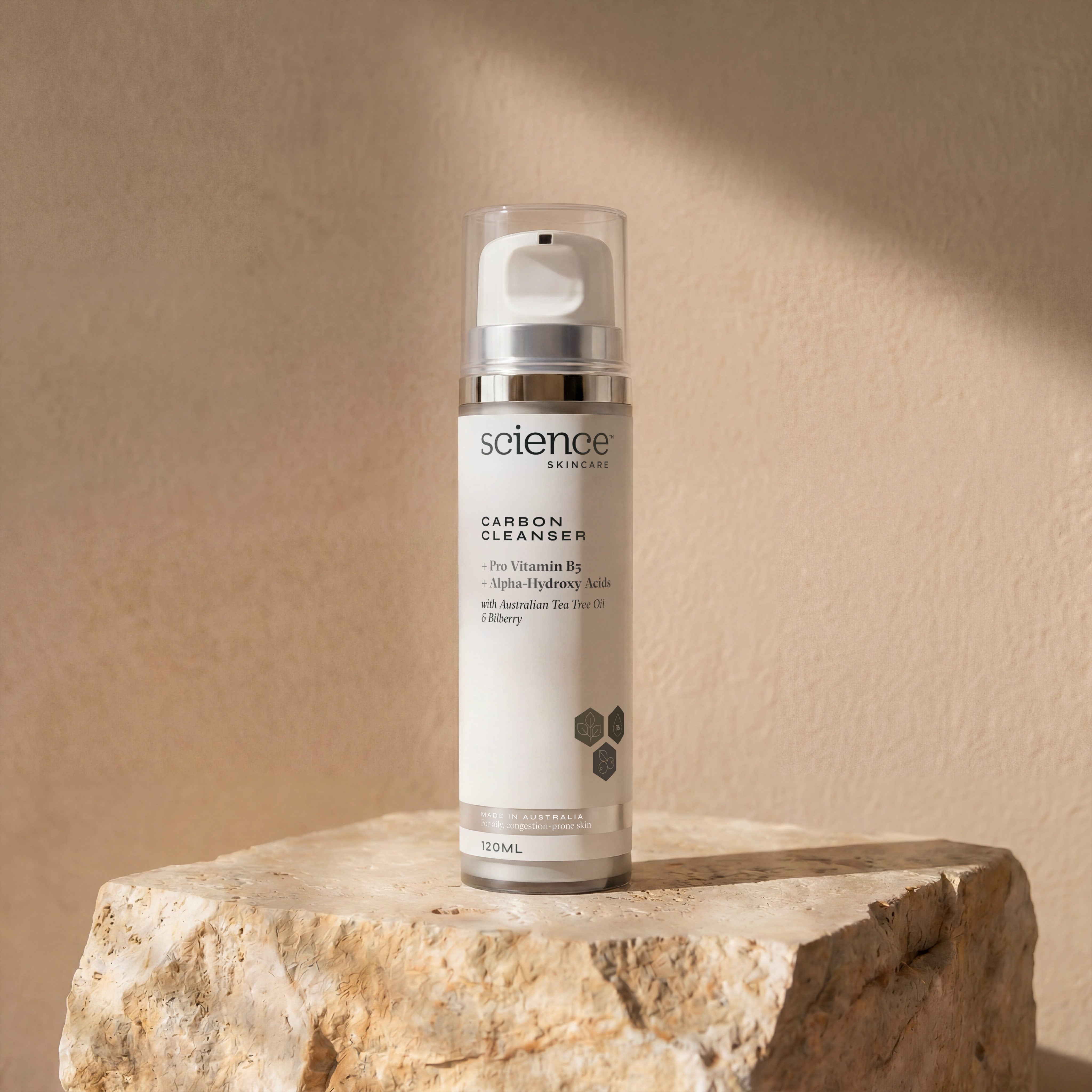 Carbon Cleanser 120ml on stone background - activated charcoal cleanser with tea tree and fruit exfoliants for oily, acne-prone skin, removes toxins and pollution
