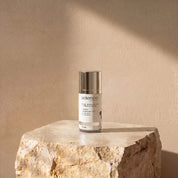 Eye Nourish + Peptides lifestyle image showing the 15ml Science Skincare eye treatment with arnica, hyaluronic acid, emu bush and sea buckthorn, styled on a raw stone plinth with natural shadow play
