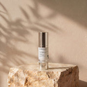Vitamin A 0.5% + B3 Serum lifestyle image showing the 30ml Science Skincare serum with retinal, niacinamide, Australian purslane and CoQ10, styled on a raw stone plinth with natural palm shadow play

